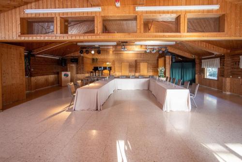 a large conference room with a long table and chairs at Logos hotel in Yad Hashmona in Yad Hashmona