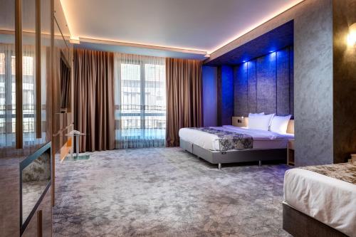 Ένα ή περισσότερα κρεβάτια σε δωμάτιο στο National Palace Wine & Spa Hotel