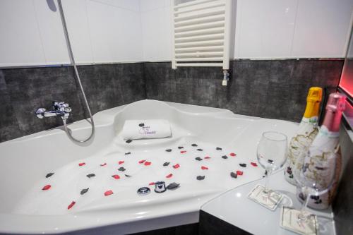 a bathroom sink with toothbrushes and toothpaste on it at Motel Venus Pontevedra in Poio