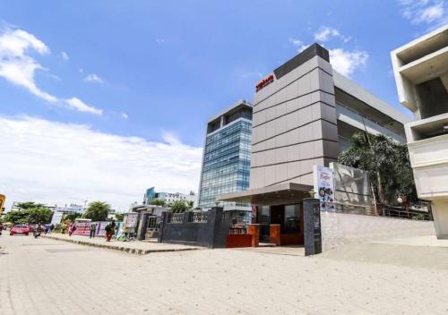 a large building in front of a street at Euphoria Extended Stays - OMR IT Expressway Chennai in Chennai
