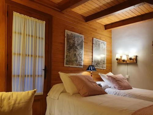 Postel nebo postele na pokoji v ubytování Chardín d'Alto-Apartamentos Chardins