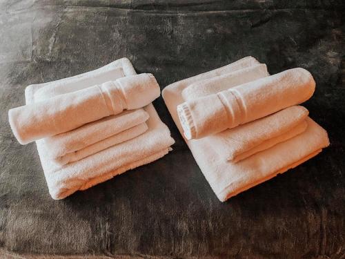 two hot dogs in buns sitting on a table at Oasis of Energy in Ljubljana