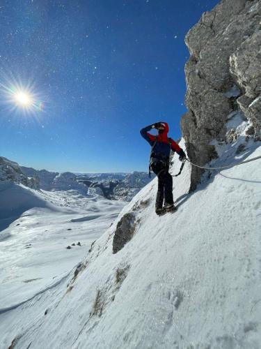 a person on skis on a snow covered mountain at Casa di Pino EcoLodge Hotel in Žabljak