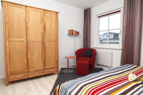 Postel nebo postele na pokoji v ubytování Strandstraße 16 Wohnung 31