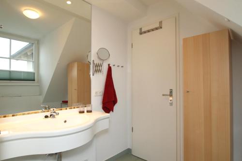 Koupelna v ubytování Strandstraße 16 Wohnung 31