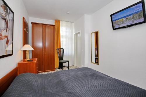 Ένα ή περισσότερα κρεβάτια σε δωμάτιο στο Residenz unter den Linden Wohnung 10