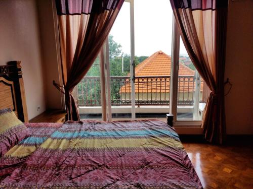 Postel nebo postele na pokoji v ubytování Mumtaz Syariah Homestay