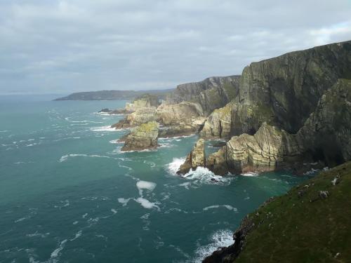 an aerial view of a rocky coastline with the ocean at Cosy Holidayhomes Kerry in Kenmare