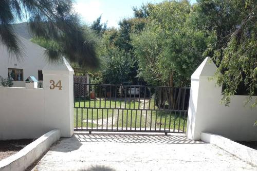 a gate in a yard with a fence at 34 Steyn Street, Barrydale in Barrydale