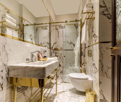a bathroom with a sink and a toilet at Cronton Design Hotel in Istanbul
