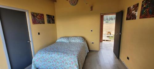 a bedroom with a bed in the corner of a room at Villa Vista in Guatavita