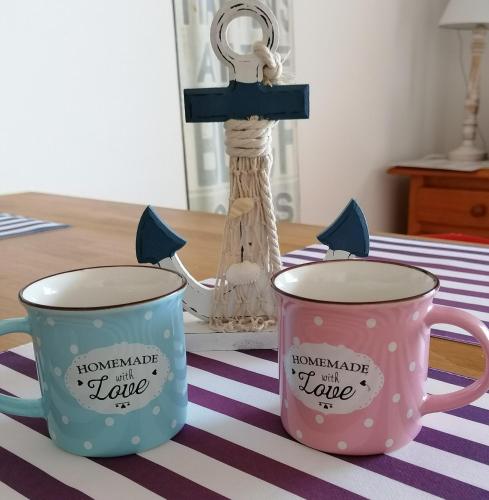 two mugs sitting on top of a table at Fisherman s Cove in Costa Calma