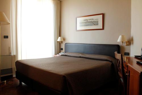 Katil atau katil-katil dalam bilik di Hotel San Giorgio