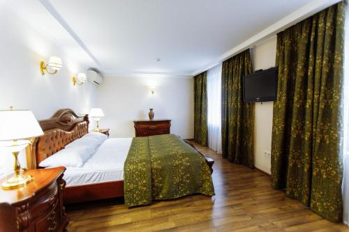 Кровать или кровати в номере Гостиница Таврия