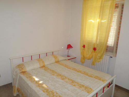 Ένα ή περισσότερα κρεβάτια σε δωμάτιο στο Residence Dolce Far Niente