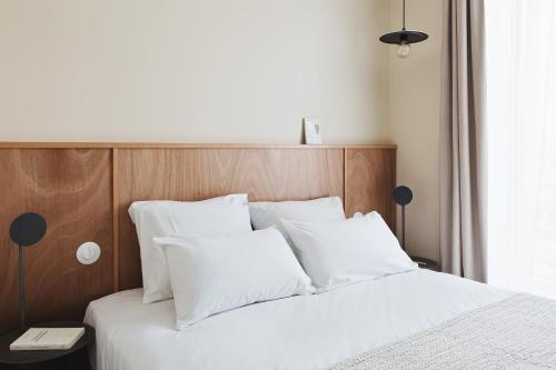 Un ou plusieurs lits dans un hébergement de l'établissement Hotel Orphée - Orso Hotels