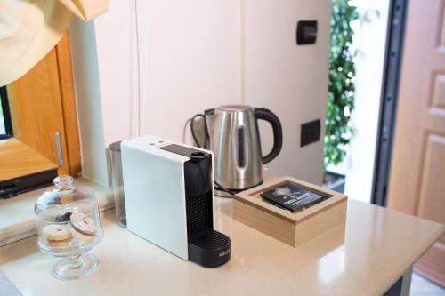 a coffeemaker sitting on top of a counter with a coffee maker at Villa Arianna Acireale in Acireale