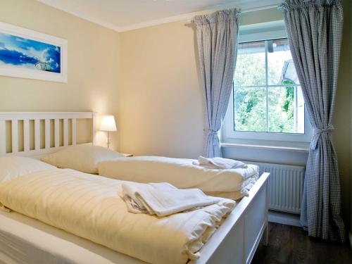 Katil atau katil-katil dalam bilik di TRA7c Ferienwohnung Kossmann