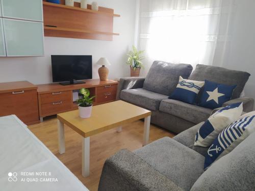 Televízia a/alebo spoločenská miestnosť v ubytovaní planta alta en casa