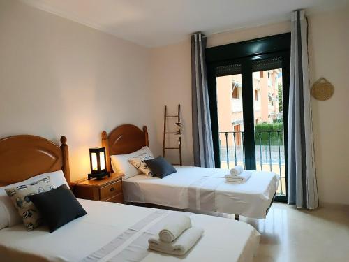 Posteľ alebo postele v izbe v ubytovaní Javea Apartment ideal for kids