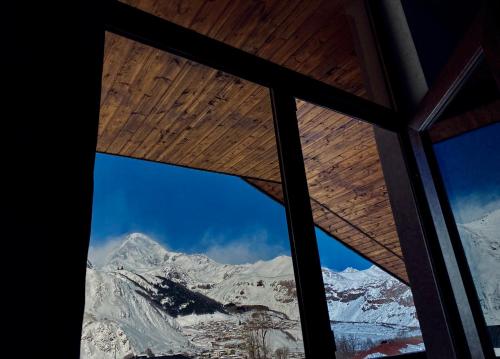 a view from a window of a mountain at Cottage Kesane in Stepantsminda