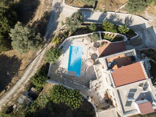 an overhead view of a house with a swimming pool at Prinus Country Retreat Apokoronas, heated pool, 13km from the sea in Embrósneros