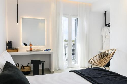 Ένα ή περισσότερα κρεβάτια σε δωμάτιο στο Sunset Windmills Suites