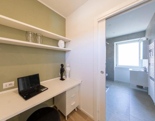 โทรทัศน์และ/หรือระบบความบันเทิงของ Residence Casa Coppa Appartamento Duplex