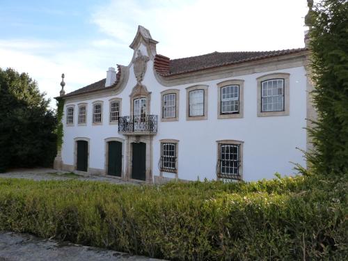 a large building with a clock on the front of it at Casa dos Barros Winery Lodge by Vintage Theory in Sabrosa
