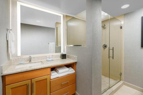 a bathroom with a sink and a shower at Hyatt House Fort Lauderdale Airport/Cruise Port in Dania Beach