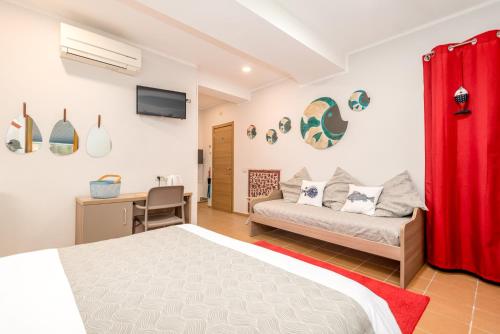 a bedroom with a bed and a desk at Carugio Remilde in La Spezia
