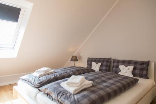 En eller flere senge i et værelse på Gulfhof Dreybült Dreybült 3 Beene