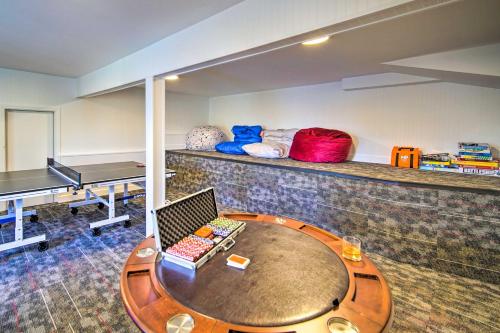 a room with a table with a laptop on it at Ridgeline Retreat with Mountain Lake Views! in Lake Arrowhead
