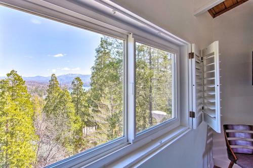 a window with a view of the mountains at Ridgeline Retreat with Mountain Lake Views! in Lake Arrowhead
