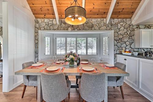 a dining room with a table and chairs at Ridgeline Retreat with Mountain Lake Views! in Lake Arrowhead