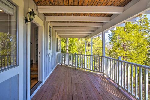 a porch of a home with a wooden deck at Ridgeline Retreat with Mountain Lake Views! in Lake Arrowhead