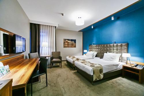 Krevet ili kreveti u jedinici u okviru objekta Holiday Inn Krakow City Centre, an IHG Hotel