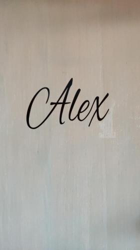 a sign with the word after written on a wall at Les coquelicots - Chambre Alex in Houdan