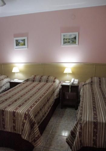 Postel nebo postele na pokoji v ubytování Hosteria Maryland