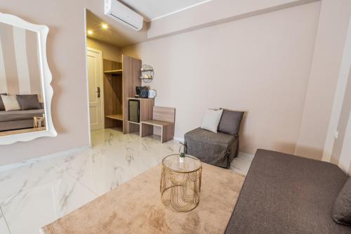 a living room with a couch and a chair at Eolian Port B&B in Milazzo