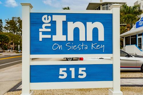 a sign for a firm on the side of a street at The Inn on Siesta Key in Siesta Key