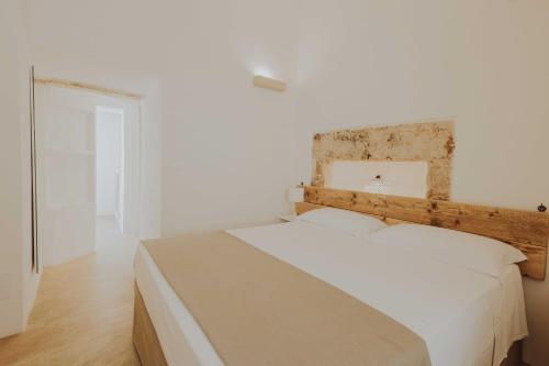 Ένα ή περισσότερα κρεβάτια σε δωμάτιο στο Badia del Casale