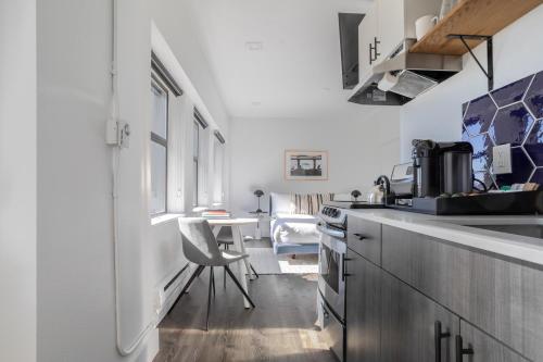 a kitchen with a table and a chair in it at Reside Seattle Downtown, a Wyndham Residence in Seattle