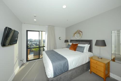 Ένα ή περισσότερα κρεβάτια σε δωμάτιο στο West Fitzroy Apartments