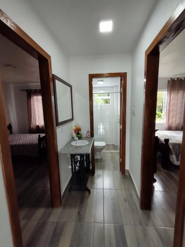 Postel nebo postele na pokoji v ubytování Apartamento em chácara com piscina próximo de praias com internet