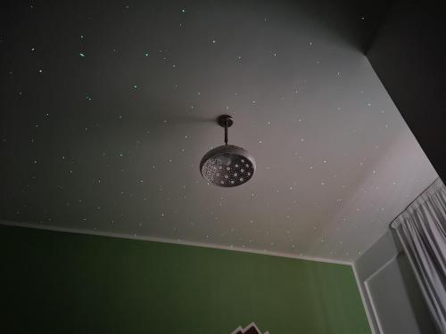 a ceiling with a light fixture in a room at La Casa Delle Stelle in Maiori