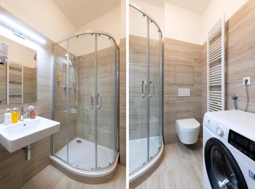 a bathroom with a shower and a sink and a washing machine at Hidden Art Boutique Residence by Dwellfort in Prague