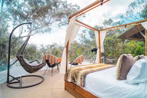 Ein Bett oder Betten in einem Zimmer der Unterkunft BubbleSky Glamping Guatapé
