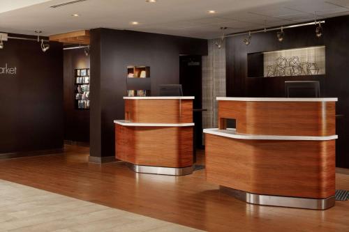 a barber shop with wooden counters in a room at Sonesta Select Laguna Hills Irvine Spectrum in Laguna Hills