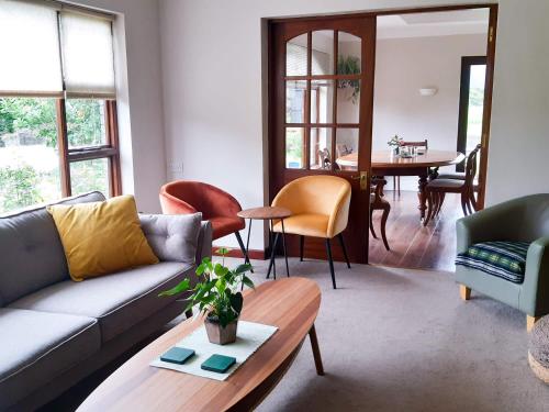 a living room with a couch and a table at Inveraray Farm B&B in Beaufort